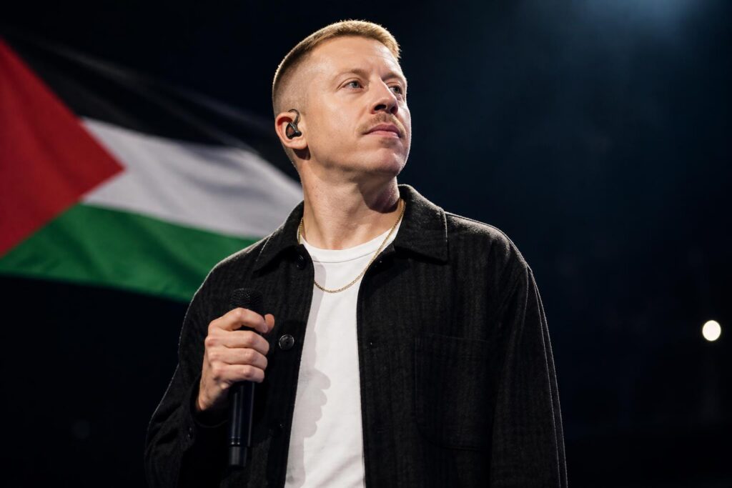 Macklemore’s Tour Slot Targeted After Palestine Plea — AI editorial illustration