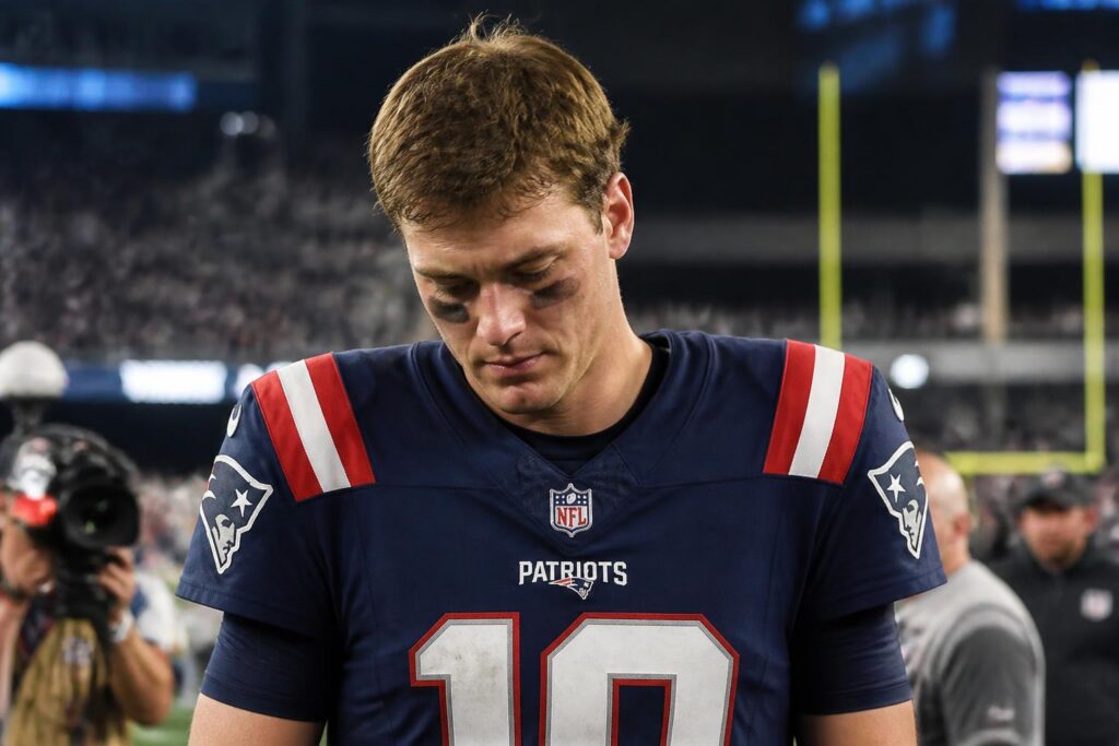 Drake Maye Owns Three Picks After Patriots Collapse — AI editorial illustration